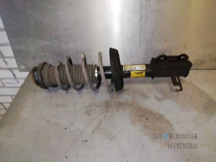 Fronts shock absorber, left Opel Astra